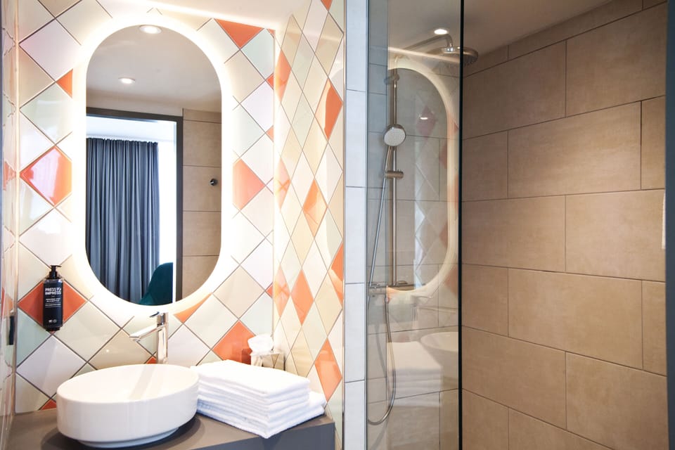 Shower, rainfall showerhead, eco-friendly toiletries, hair dryer