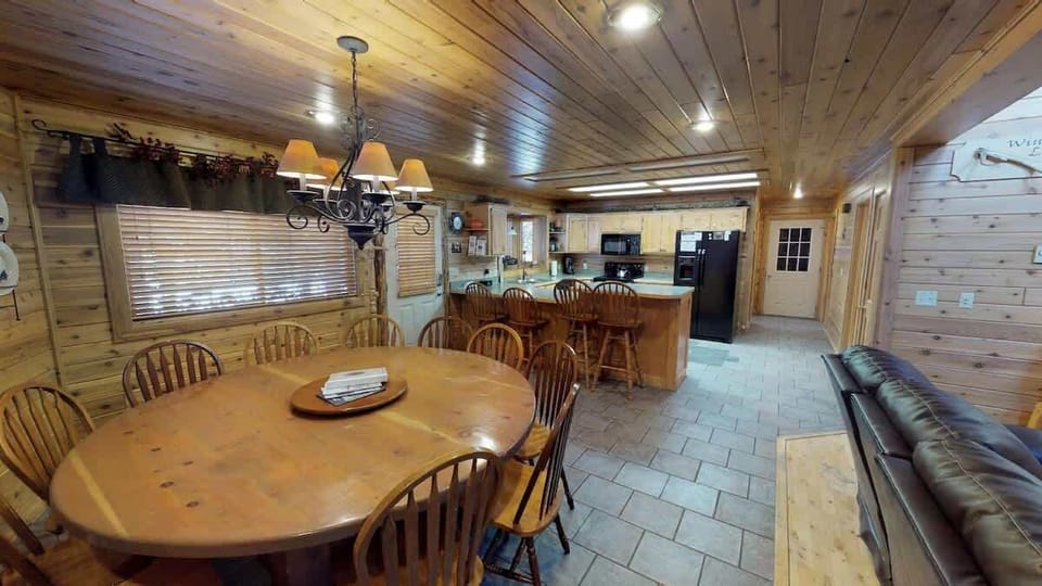 View the kitchen from the dining area with the open concept of the cabin.