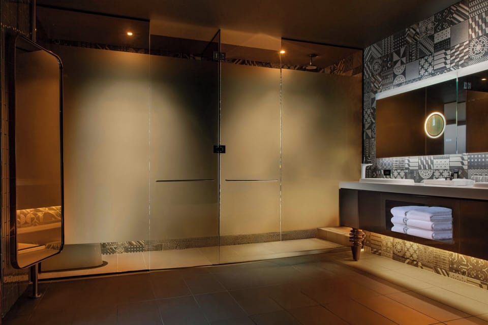 Designer toiletries, hair dryer, bathrobes, towels
