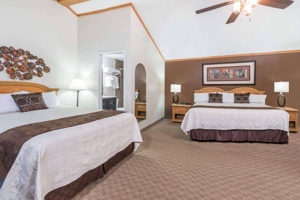 Deluxe Room, Multiple Beds, Non Smoking, Pool View | Pillowtop beds, blackout drapes, iron/ironing board, free WiFi