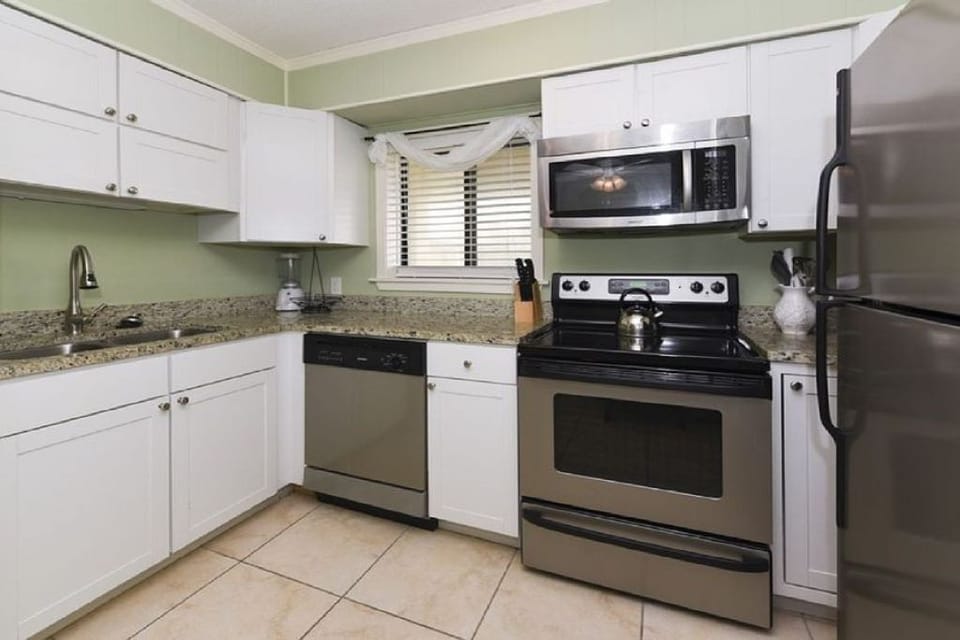 Fully stocked kitchen with stainless appliances