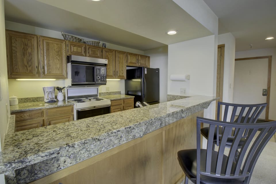Beautiful kitchen offers barstool seating at the counter
