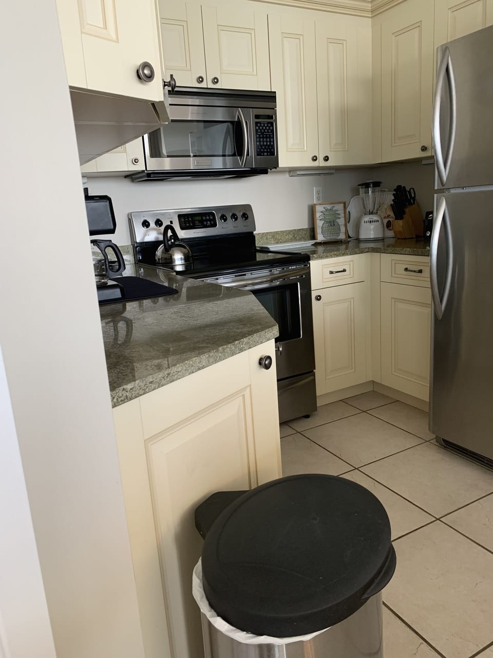 Updated kitchen fully equipped with stainless steel appliances.