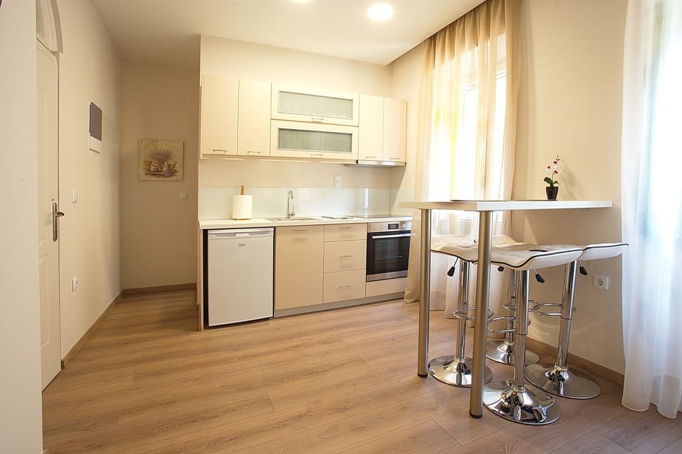 Deluxe Apartment, 1 Bedroom | Private kitchen | Full-size fridge, oven, stovetop, espresso maker