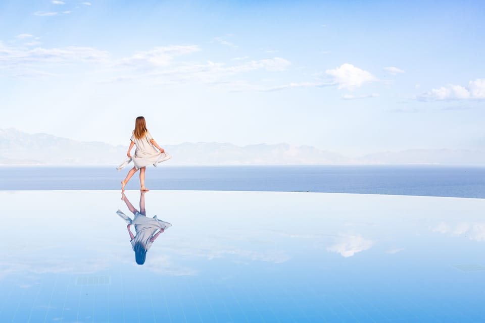 Seasonal outdoor pool, open 10:00 AM to 7:00 PM, pool umbrellas