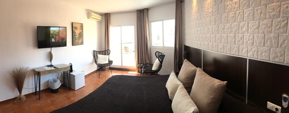 Junior Suite, Terrace, Sea View | Premium bedding, minibar, in-room safe, blackout drapes