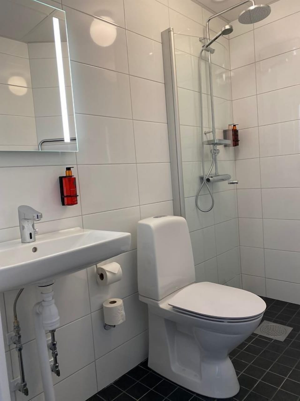 Shower, designer toiletries, hair dryer, towels