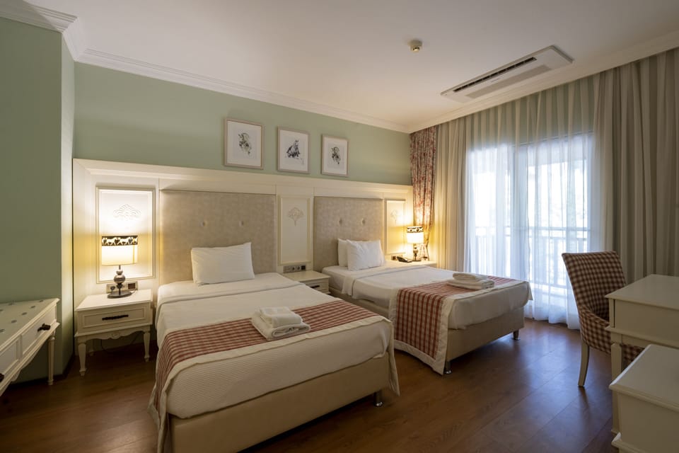Premium Quadruple Room | Hypo-allergenic bedding, memory foam beds, free minibar, in-room safe