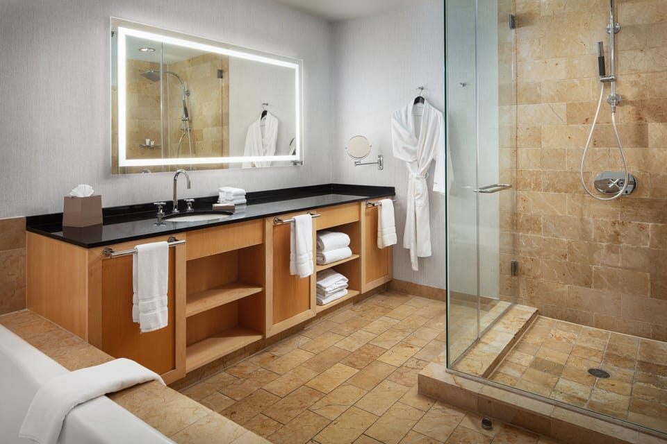Separate tub and shower, deep soaking tub, designer toiletries