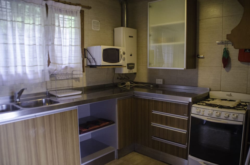 Apartment, 2 Bedrooms | Private kitchen | Full-size fridge, microwave, stovetop, coffee/tea maker