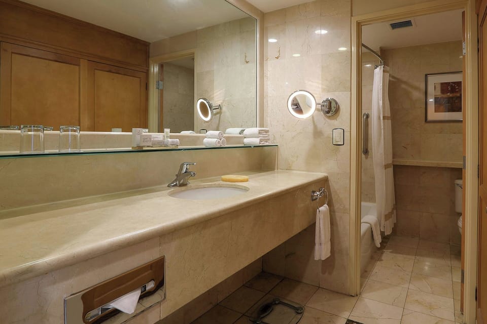 Combined shower/tub, deep soaking tub, free toiletries, hair dryer
