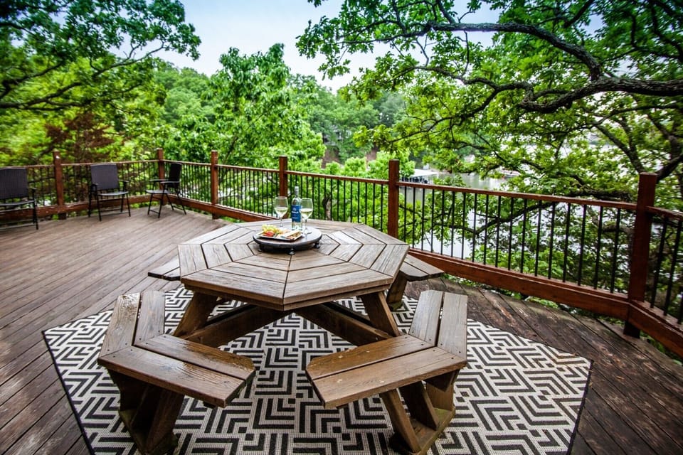 Deck area with picnic table and grill.
