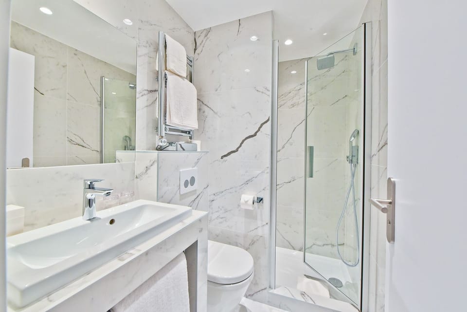 Prestige Triple Room | Bathroom | Designer toiletries, hair dryer, bathrobes, slippers