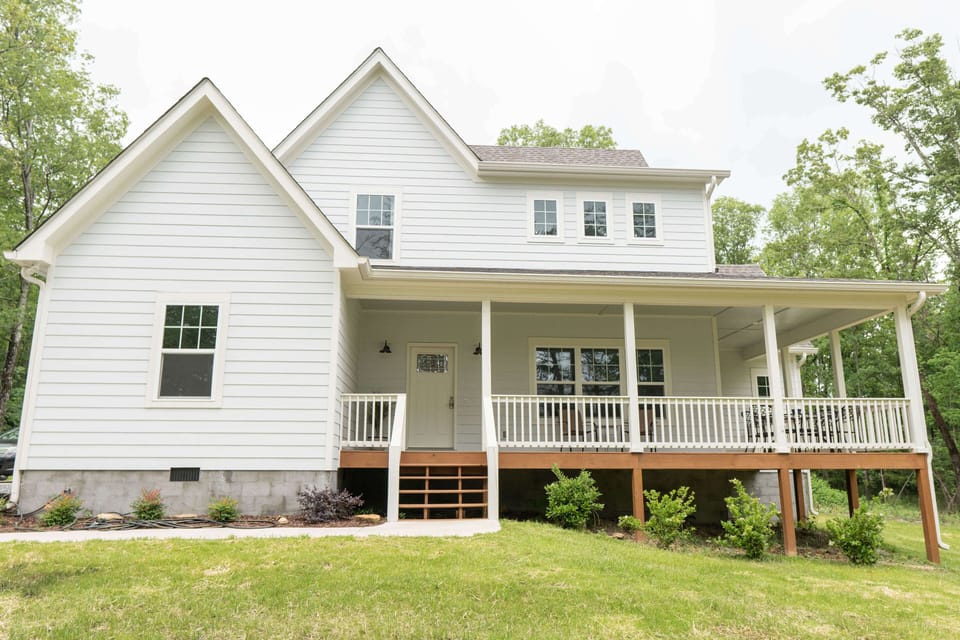 Front view of home with wrap around porch.