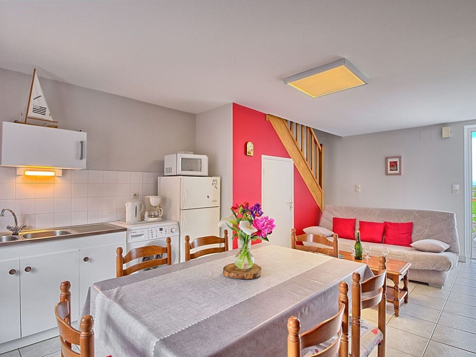 Furniture, Flower, Table, Plant, Cabinetry, Building, Chair, Orange, Lighting, Countertop