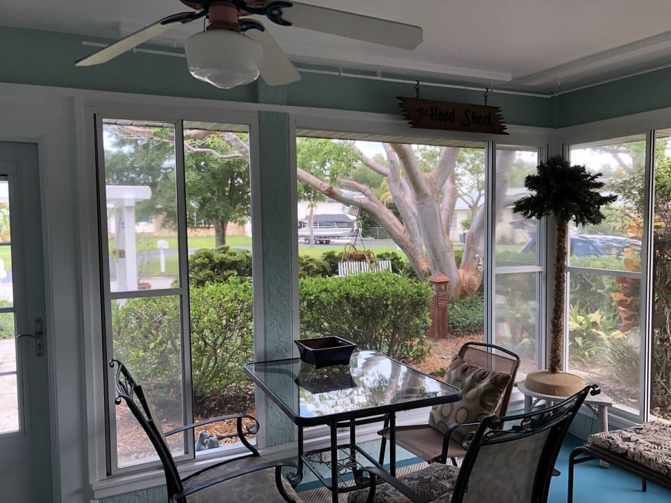 Lanai with sliding window panels open. 