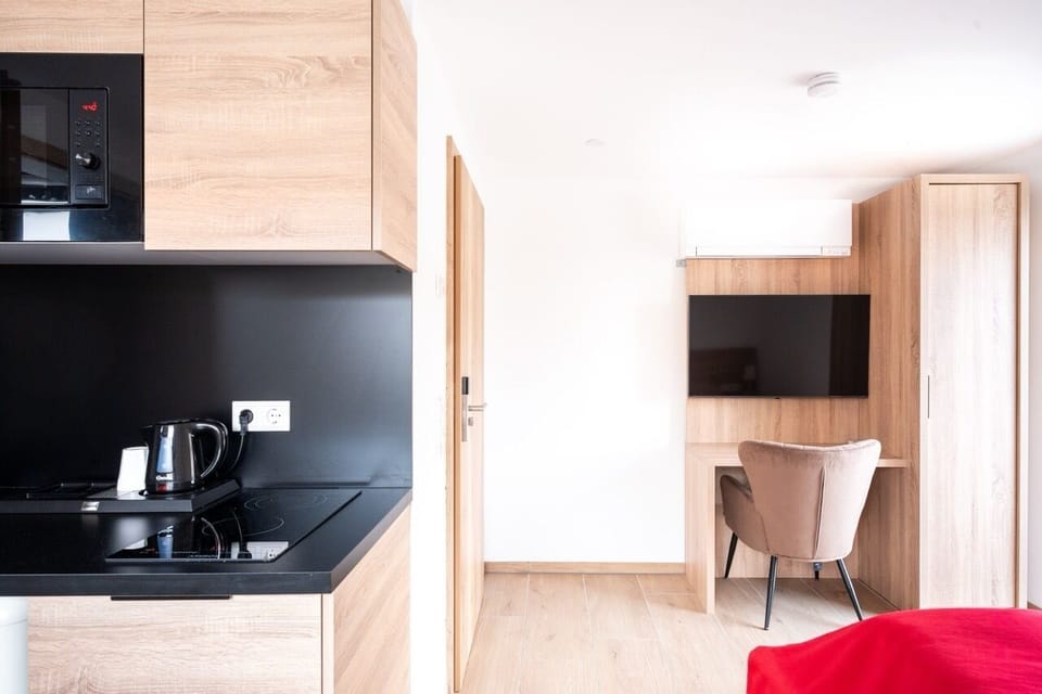 Comfort Studio, 1 Large Twin Bed, Non Smoking, Balcony | Living area | Flat-screen TV, heated floors