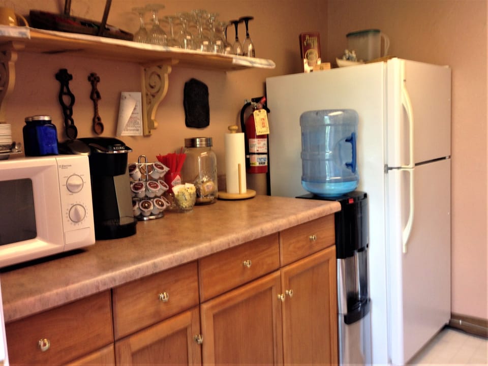 Shared fridge, microwave, electric kettle, cookware/dishes/utensils
