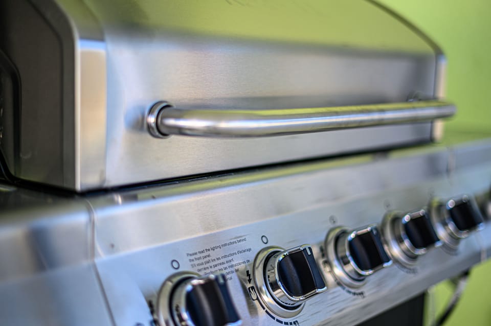 Family sized grill on the pool patio
