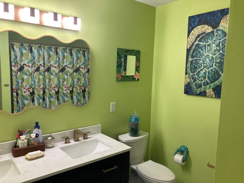 Downstairs master bathroom with double sinks.
