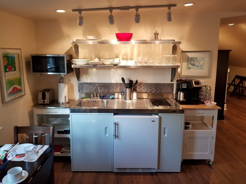 Fully equipped kitchenette with stovetop. 