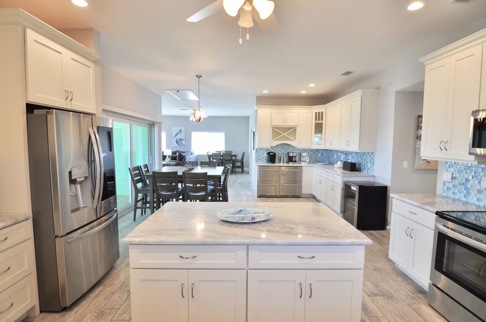 Kitchen, sea glass back splash, full size fridge, 2 commercial drawer fridges