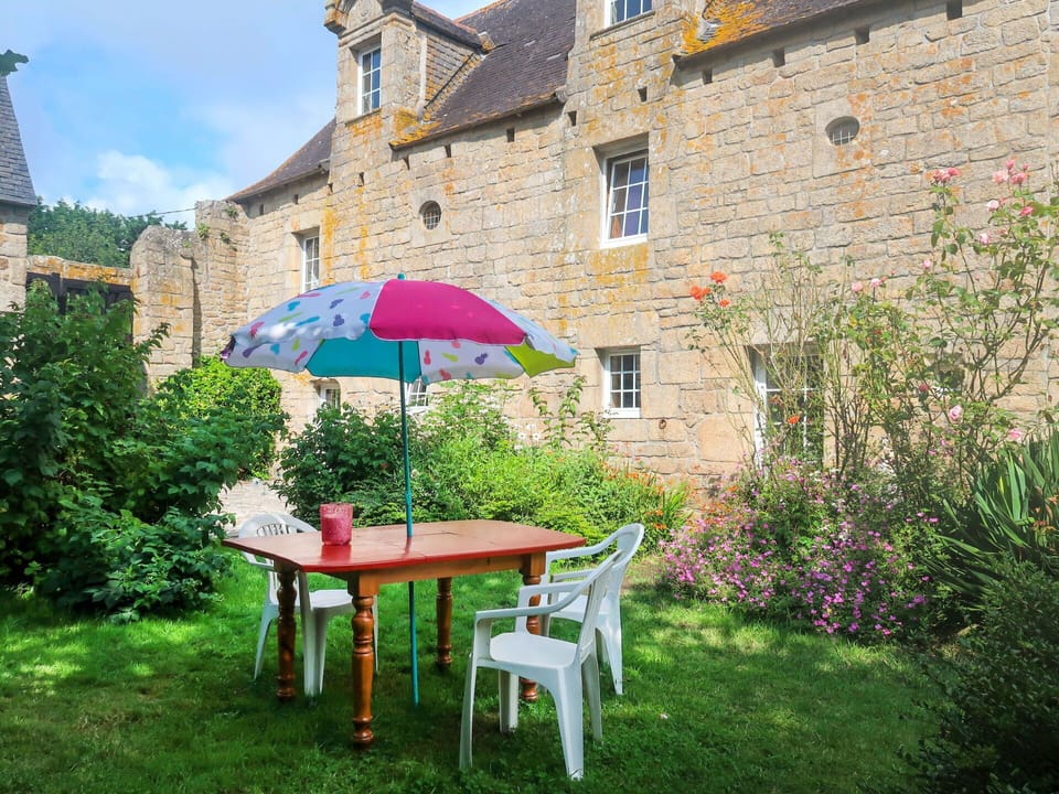 Plant, Property, Sky, Building, Window, Table, Outdoor Table, Outdoor Furniture, Natural Landscape, Chair