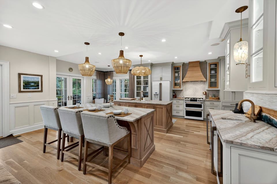 Fully equipped kitchen with with bar stools, wine fridge, and plenty of space for cooking!