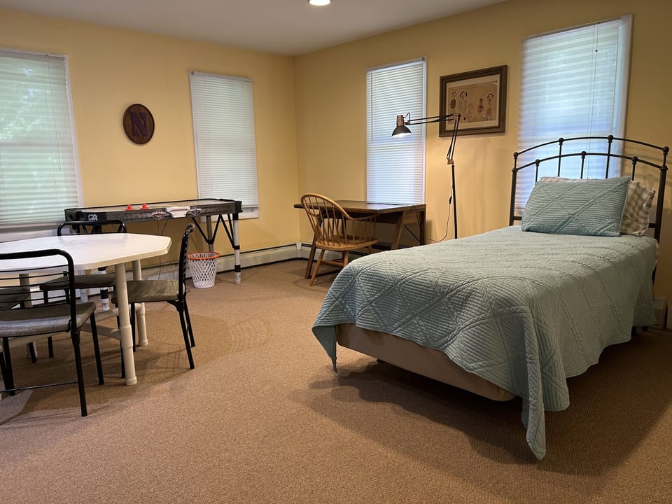Lower Level TV Room with Queen Sleeper, Twin Bed, Game Table and Air Hockey
