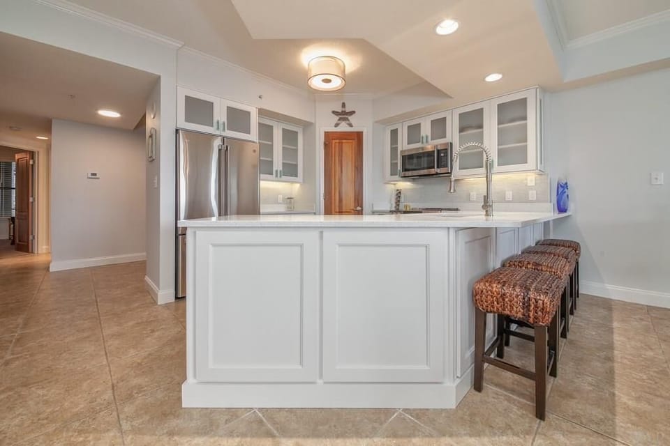 View of kitchen facing to the back of condo 
