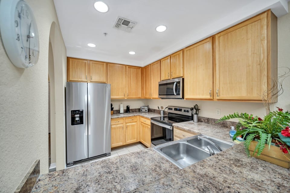 Another view of the large kitchen over the breakfast bar.