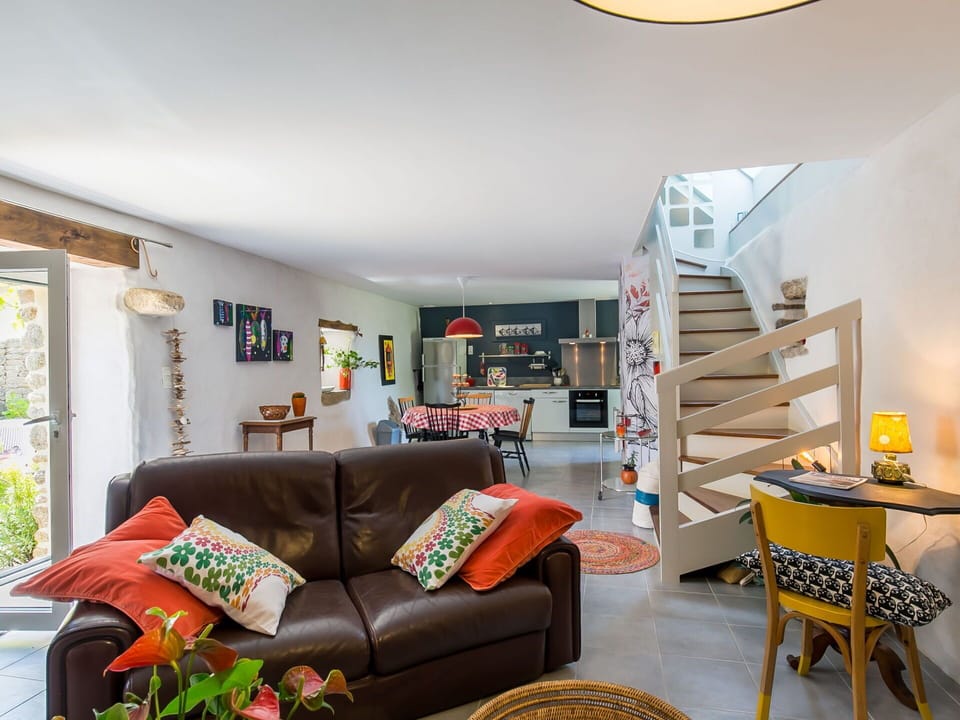 Furniture, Couch, Property, Table, Bookcase, Lighting, Living Room, Yellow, Wood, Flooring