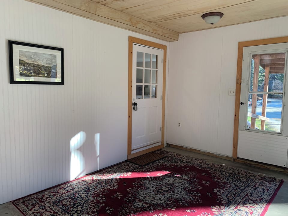 Walk up ramp and enter patio, lockbox is on inside door handle.