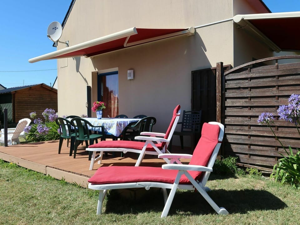 Plant, Furniture, Building, Shade, Chair, Sky, Outdoor Furniture, Land Lot, Grass, Cottage