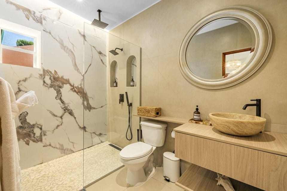 Refresh in the newly renovated bathroom, complete with a luxurious walk-in rain shower.
