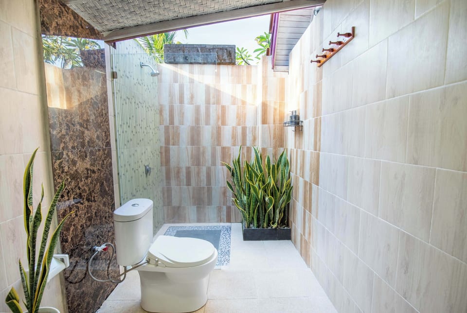 Shower, bathrobes, slippers, bidet