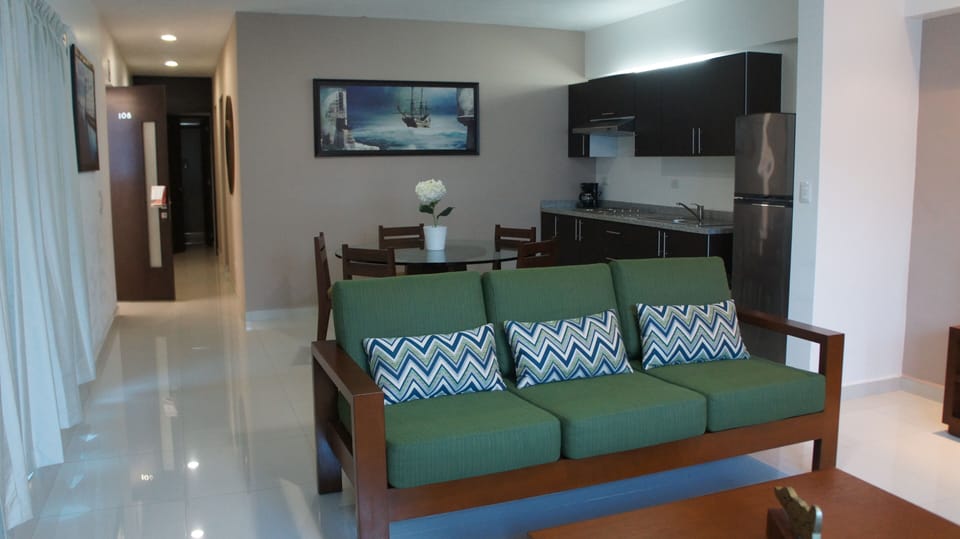 Superior Suite | Living room | 32-inch flat-screen TV with cable channels, TV