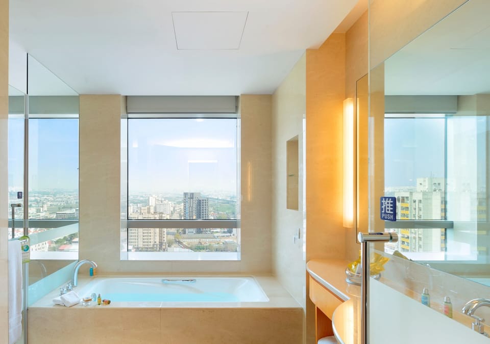 Business Room, 1 King Bed | Bathroom | Separate tub and shower, deep soaking tub, rainfall showerhead