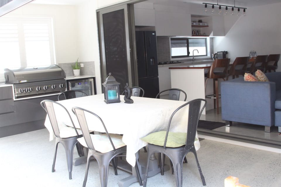 Outdoor BBQ and patio beside the lounge.