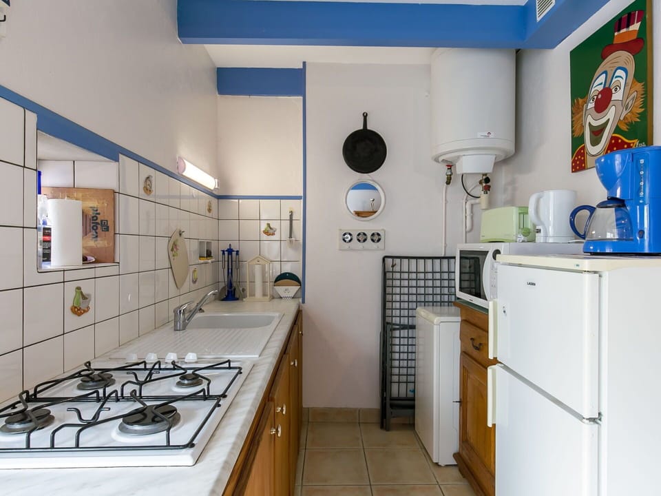 Cabinetry, Property, Blue, Kitchen, Kitchen Appliance, Interior Design, Building, Countertop, Kitchen Stove, Floor