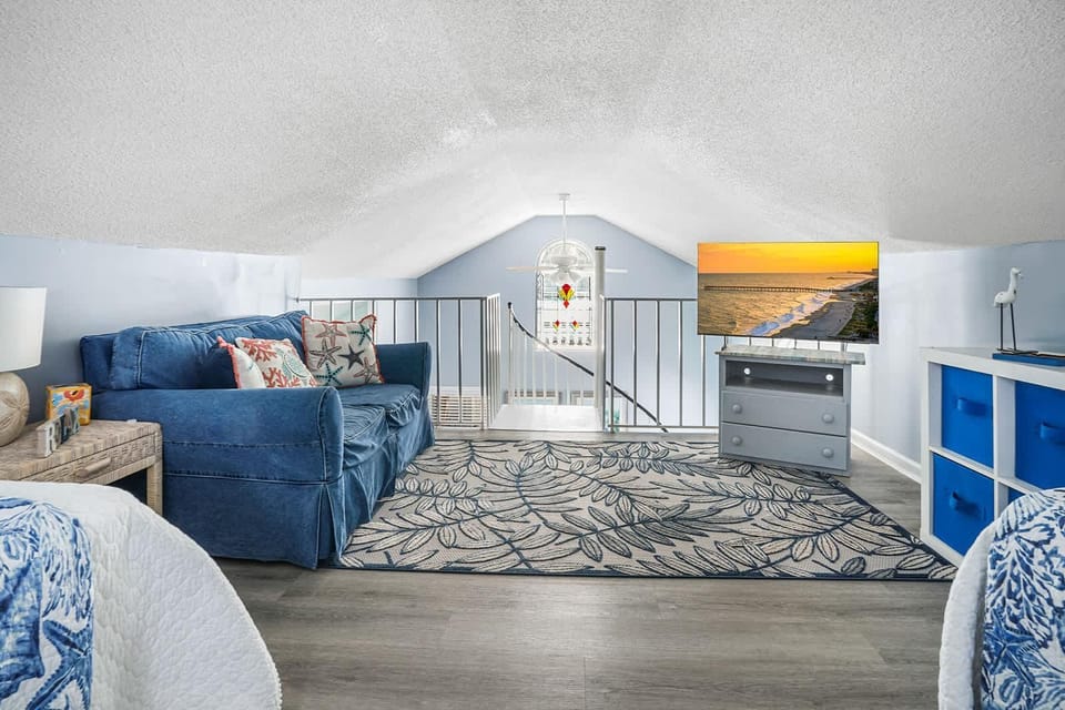 Cozy attic living room with plush seating and vibrant accents