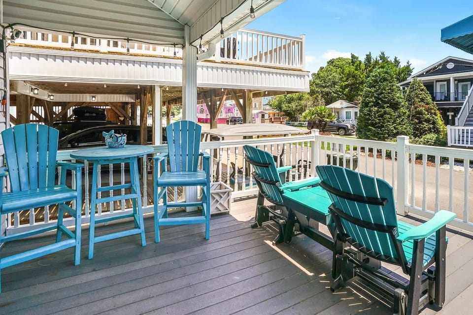 Sunny outdoor deck with cozy seating and vibrant views