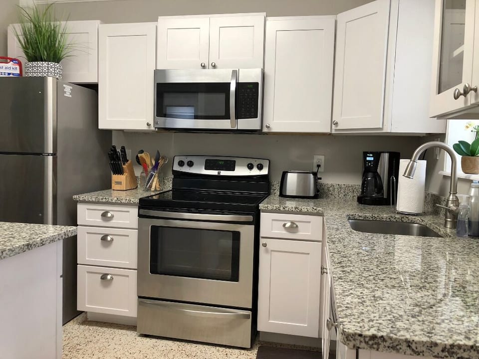 Kitchen is fully stocked with pots/pans, dishes, utensils & regular coffee maker