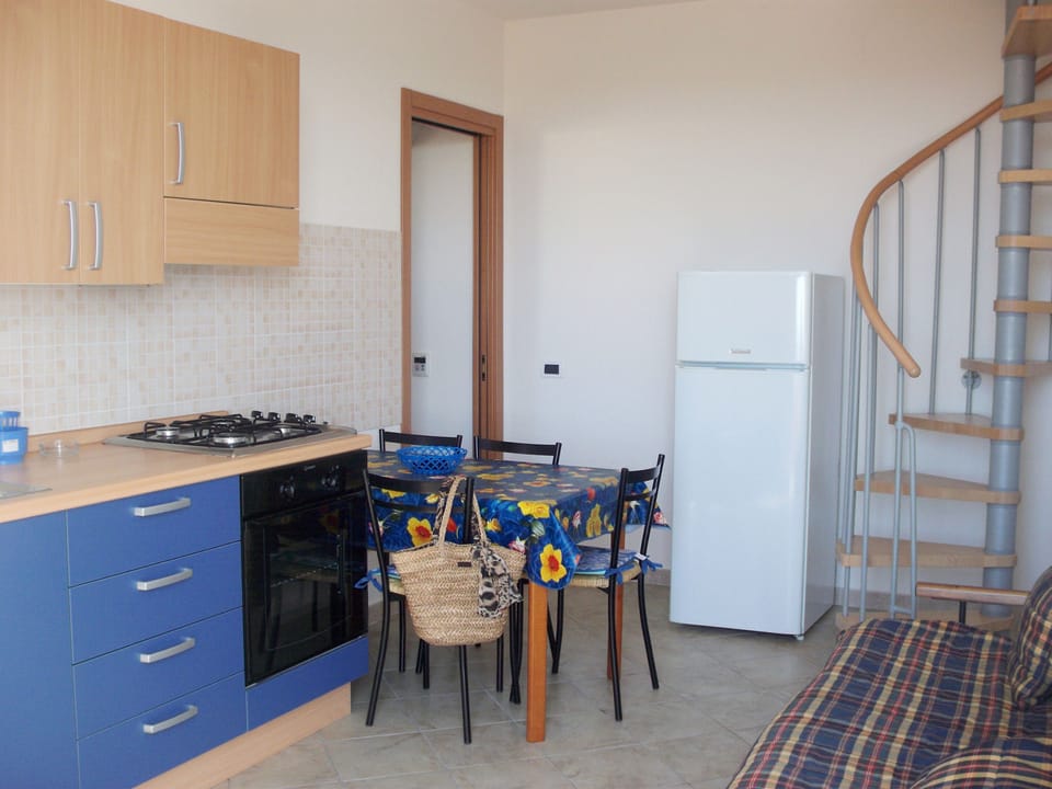 Classic Apartment, Kitchenette | Private kitchenette | Full-size fridge, stovetop, cookware/dishes/utensils