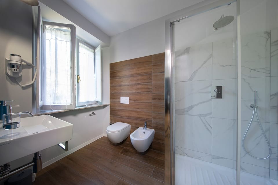 Exclusive Room | Bathroom | Shower, rainfall showerhead, hair dryer, bathrobes