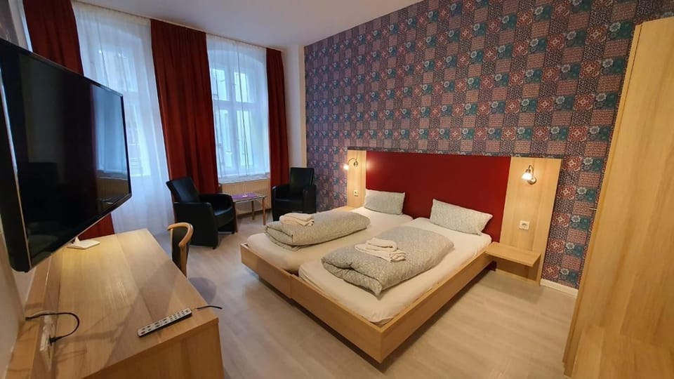 Double Room | Desk, blackout drapes, iron/ironing board, free cribs/infant beds