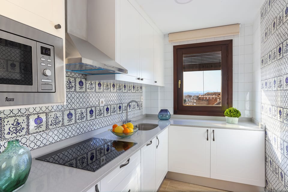 Apartment (4 Bedrooms) | Private kitchen | Full-size fridge, microwave, coffee/tea maker, toaster
