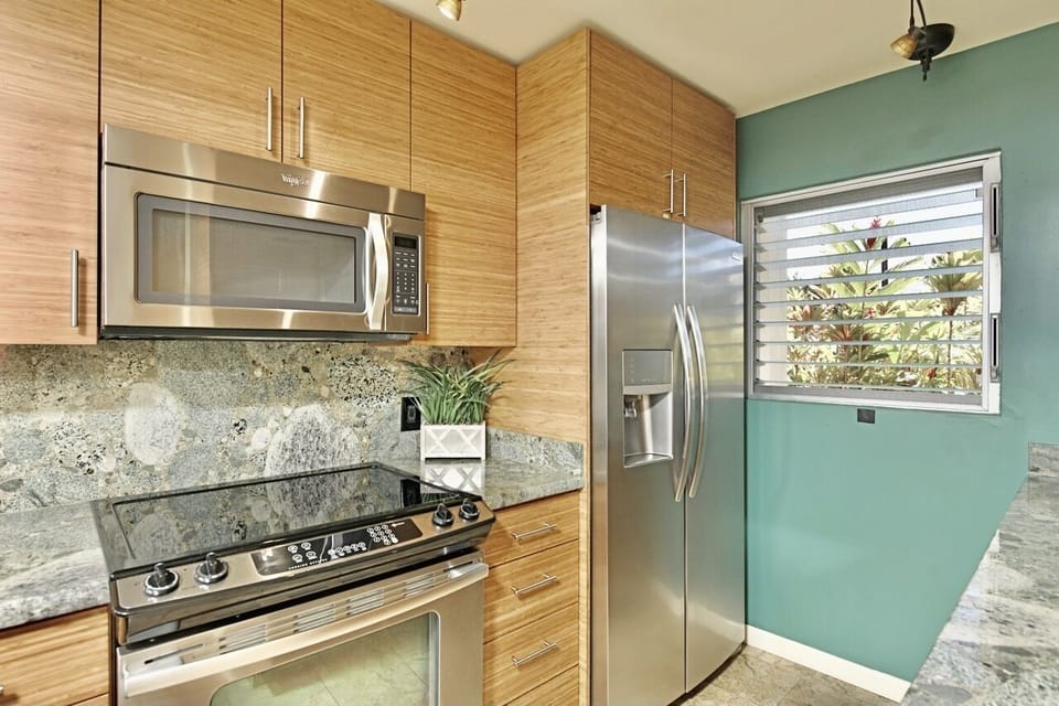 Modern kitchen with stainless steel appliances, ready for culinary creativity.