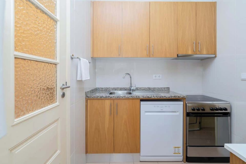 The kitchen is equipped with fridge, stove, oven, microwave, dishwasher, coffee machine, exhaust fume and utensils.