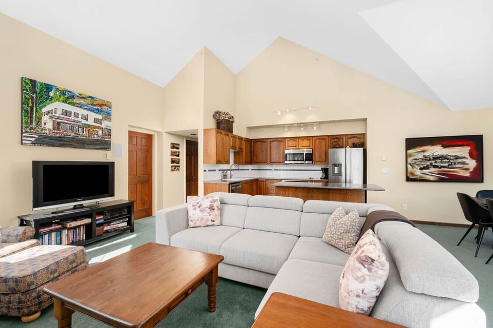 Gather around for movie night or après-ski chats in the cozy, mountain-inspired living room.